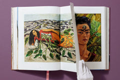 Interior spread with a still life and a painted self-portrait — Frida Kahlo.