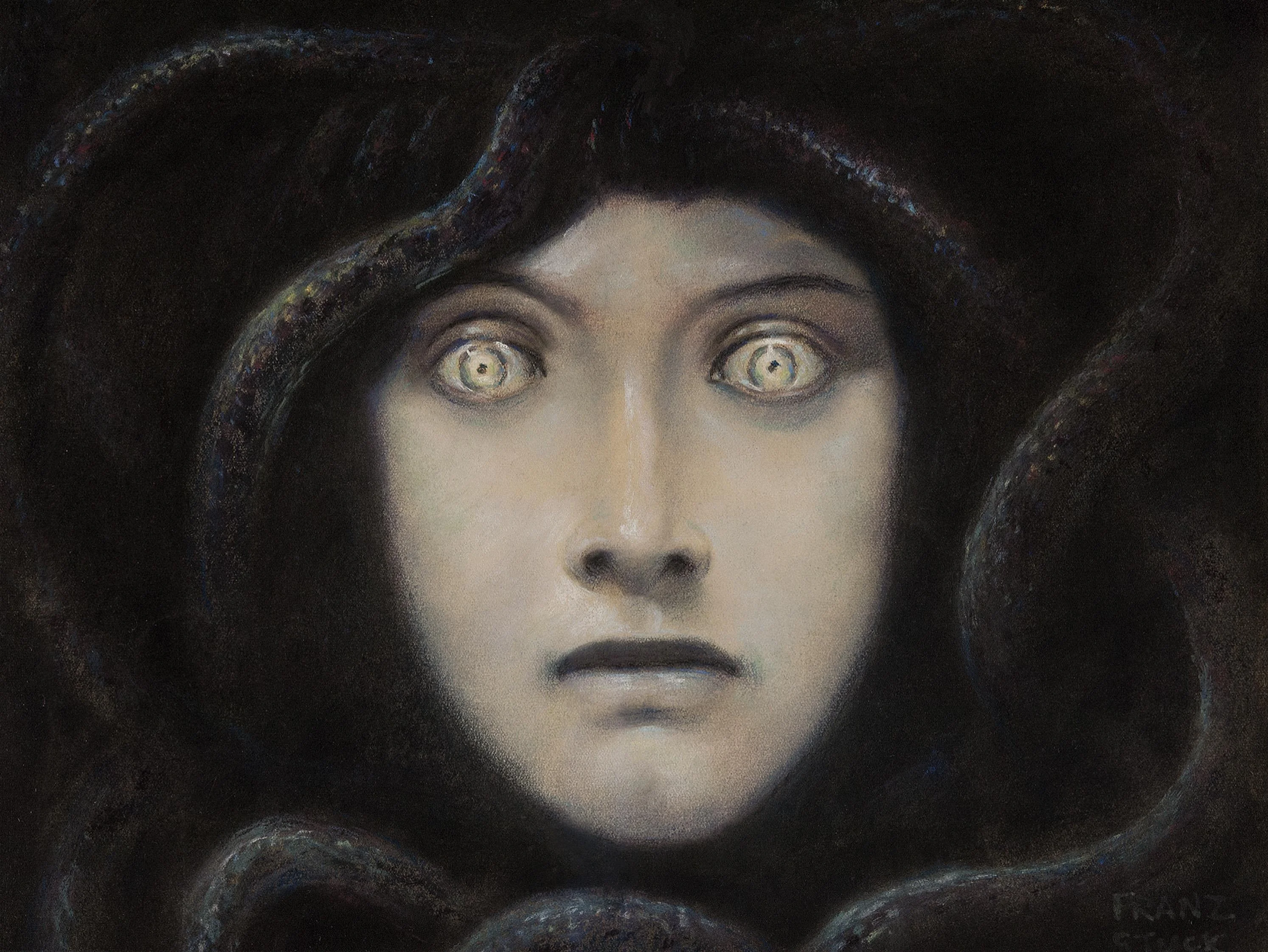 The Head of Medusa by Franz von Stuck, 1892: a pale face surrounded by dark serpents