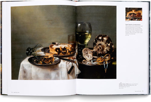 Interior spread featuring food, glassware and a skull on a table — Still Life: Timeless Beauty.